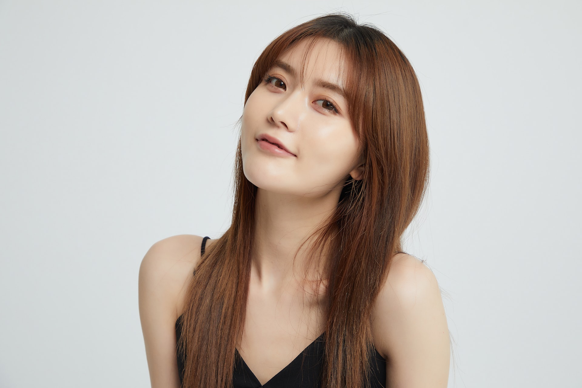 a woman with long hair and a black top